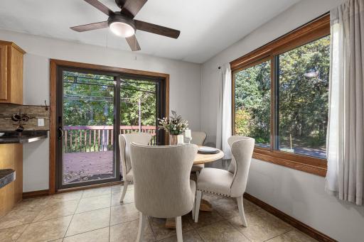 Dining room with deck and front yard view