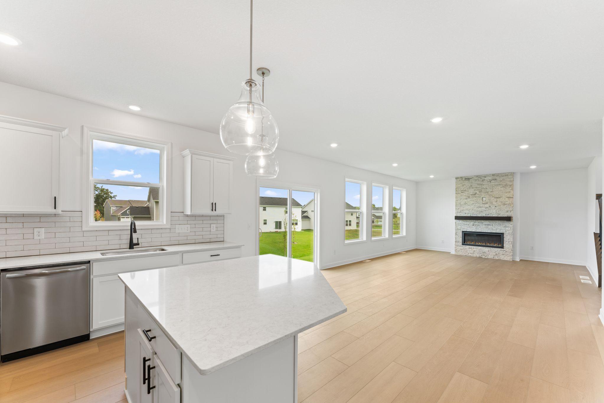 The center island overlooks the rest of the home in an ideal set-up for everyday living