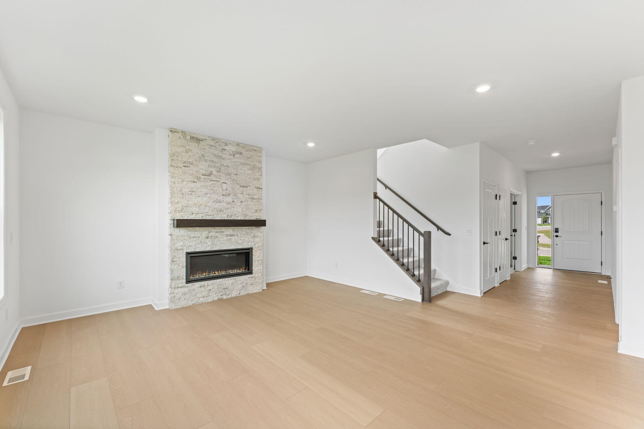 A center fireplace sets the scene for cozy nights