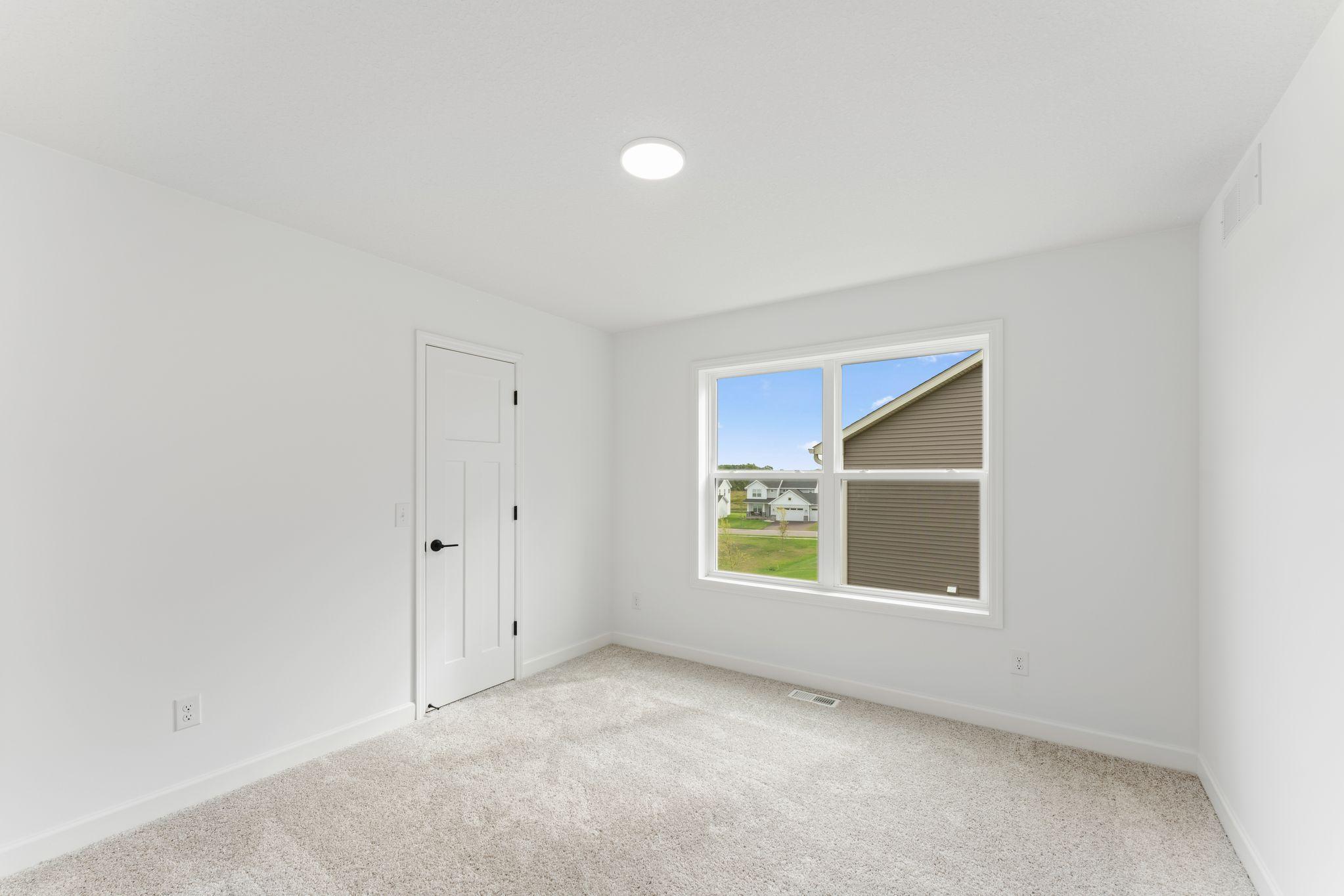 Three secondary bedrooms can be found upstairs, just down the hall from the owner’s suite.