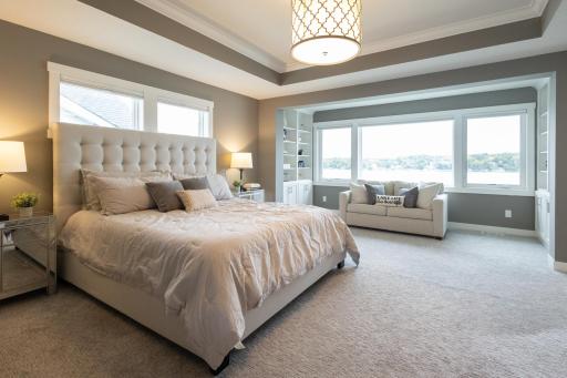The primary suite features a sitting area, a large bathroom, and a walk-in closet.
