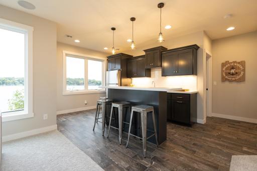 This home was designed for entertaining! The lower level kitchen is perfect for hosting parties, or grabbing a snack on your way down to the lake.