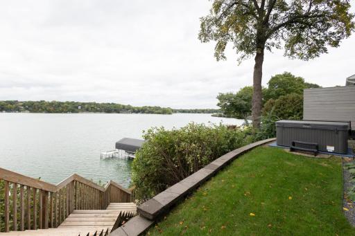 Relax in the hot tub overlooking the lake.
