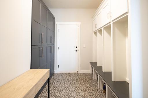 Mud room with built in storage leading from the 3 car garage into the home.