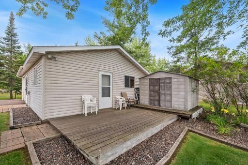 Deck on garage that has an area that could be used as a bunk house or additional garage space