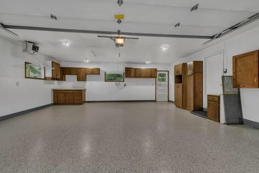 Attached garage is insulated, heated, with shelving and epoxied floor