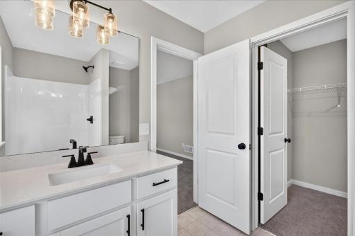 Private Primary Bath. Photo taken of another home with similar plan and finishes.