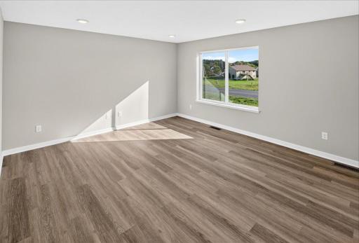 Living Room. Photo taken of another home with similar plan and finishes.