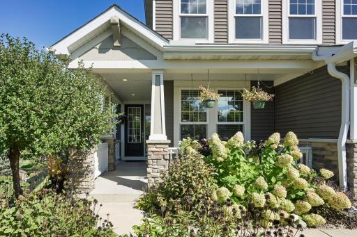 Beautiful landscaping and a spacious covered porch