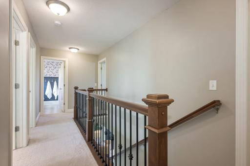 Open upper-level landing with elegant railing detail