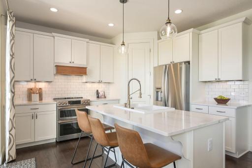 Gourmet Kitchen with gernerous island seating and stainless appliances