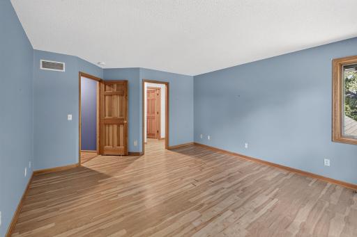 View to closet in primary bedroom