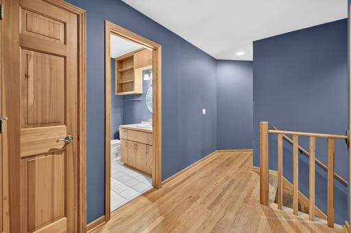 Landing with view into upper bathroom