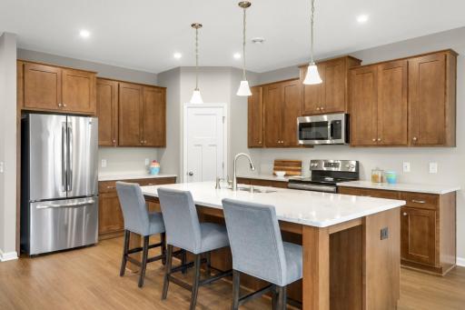 Kitchen features a large island and stainless steel appliances
