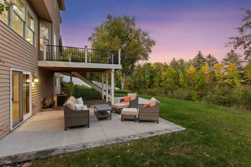 Newly poured concrete patio offers the perfect space for outdoor entertaining and gathering around a fire pit.