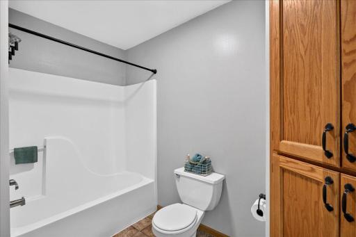 Full Upper Bathroom with tube and shower combination.