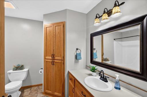 Full Bathroom with Built-In Storage Upper Bathroom