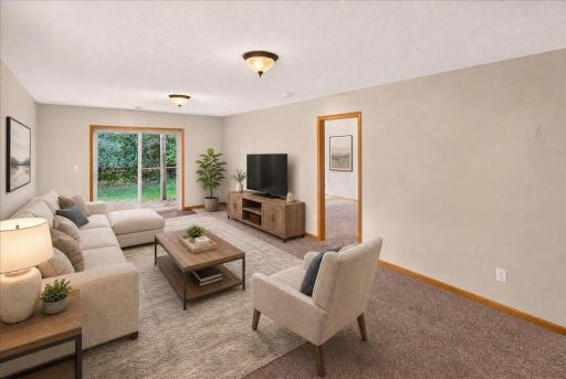 Spacious Family Room with walk out patio staged virtually