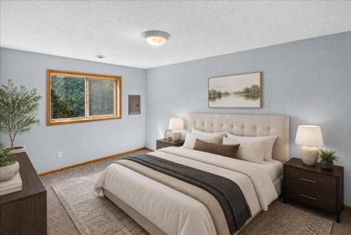 Large Lower Bedroom staged virtually with King size bed
