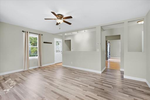 Bright and inviting, the main living space offers plenty of room to settle in and make it your own.