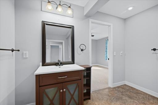 The main-level bath offers a spacious layout, updated finishes and convenient access to both main level bedrooms.