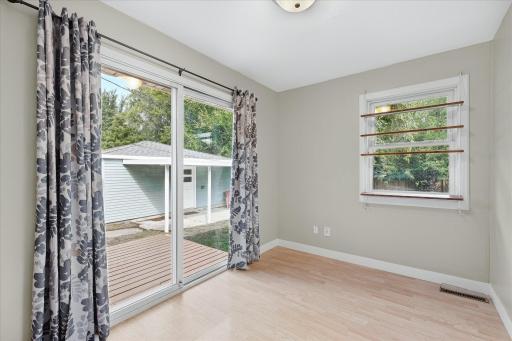 The dining space opens directly to the backyard deck—perfect for morning coffee, grilling or easy indoor-outdoor entertaining.