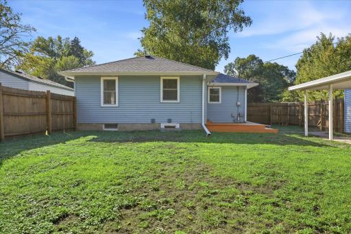 A generous fenced yard offers plenty of room for pets, play, gardening, entertaining, and making the outdoor space your own.