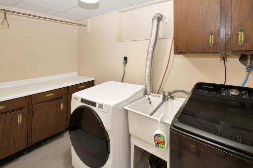 Laundry room with folding and hanging area.jpg