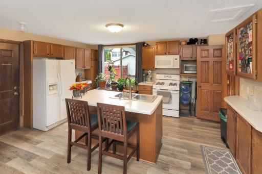 Spacious kitchen with a center island and loads of cabinet space.jpg