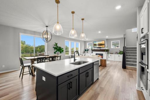 The kitchen opens naturally to the dining and living areas.