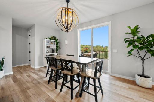 Statement lighting and wide sightlines make it easy to move between cooking, gathering, and entertaining.