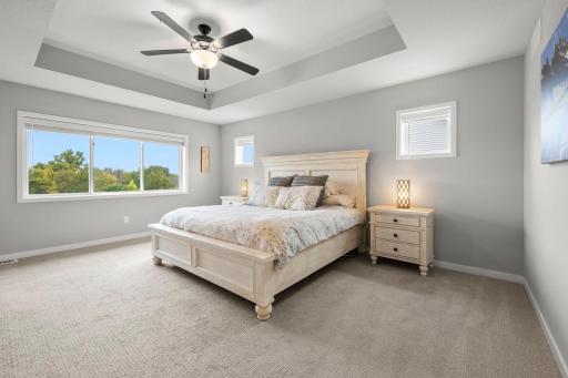 Spacious primary suite features a 12x6 walk-in closet and private ensuite.