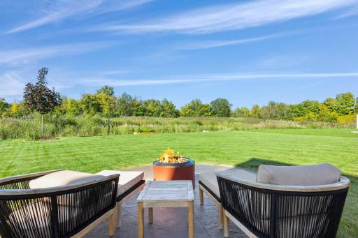 A fire pit sets the stage for evenings outside.