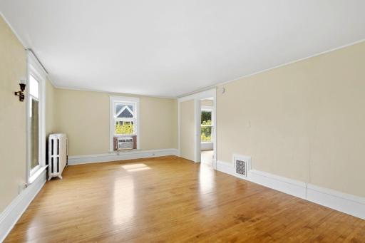 Huge front living room/rec room or primary suite