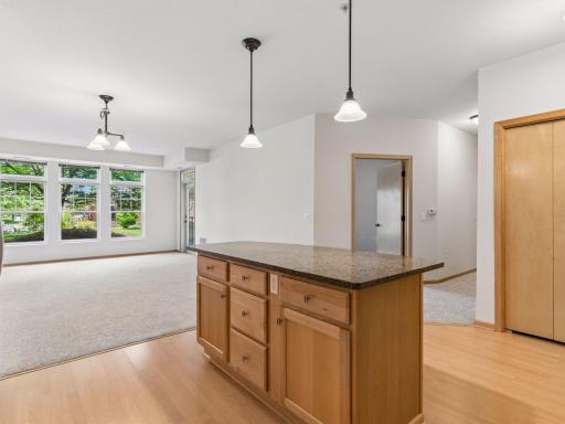 Enjoy an open, flowing floor plan with warm wood flooring and abundant natural light.
