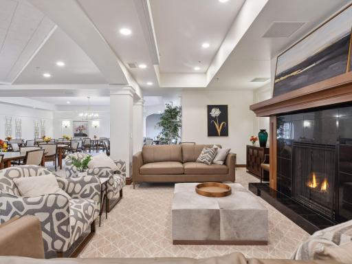 Relax in the beautifully furnished lounge featuring an elegant fireplace.
