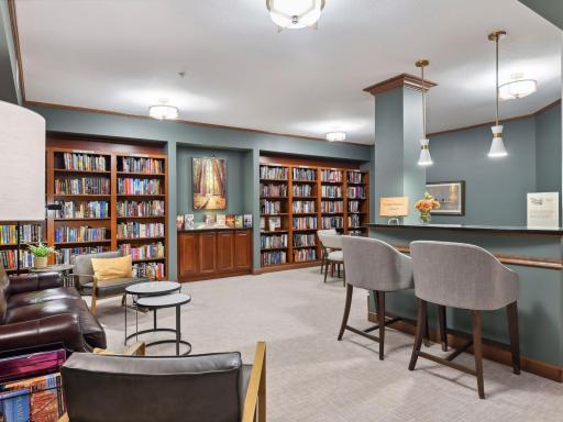 A warm and inviting library with comfortable seating and extensive bookshelves.