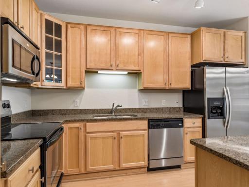 Beautiful cabinetry, granite countertops and stainless steel appliances.