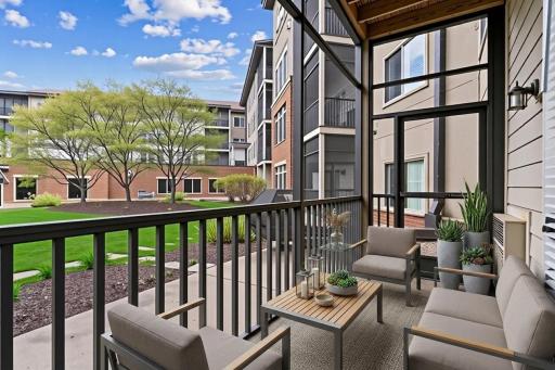 Enjoy fresh air and peaceful surroundings on your private screened patio.