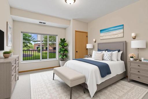 Virtual staging of the spacious second bedroom featuring abundant natural light, fresh carpeting, and tranquil courtyard viewsâperfect for guests or a home office.