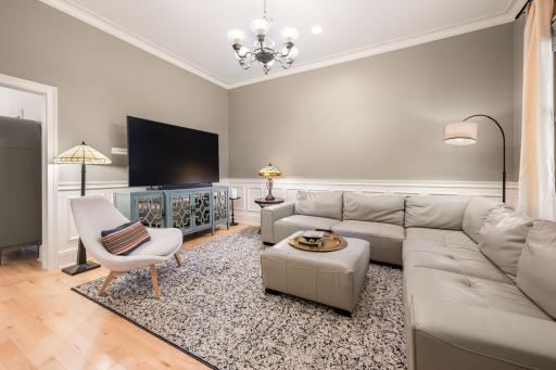 The airy, and bright living room invites you in.