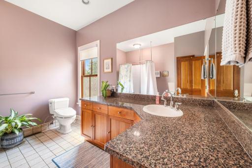 The oversized vanity in the primary bath has plenty of storage for all of your necessities.