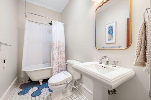 Additional upper level full bathroom with gorgeous tile detail.