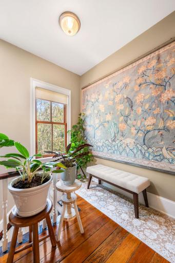 Sunlit nook at the top of the stairs-the perfect spot to cozy up with a book!