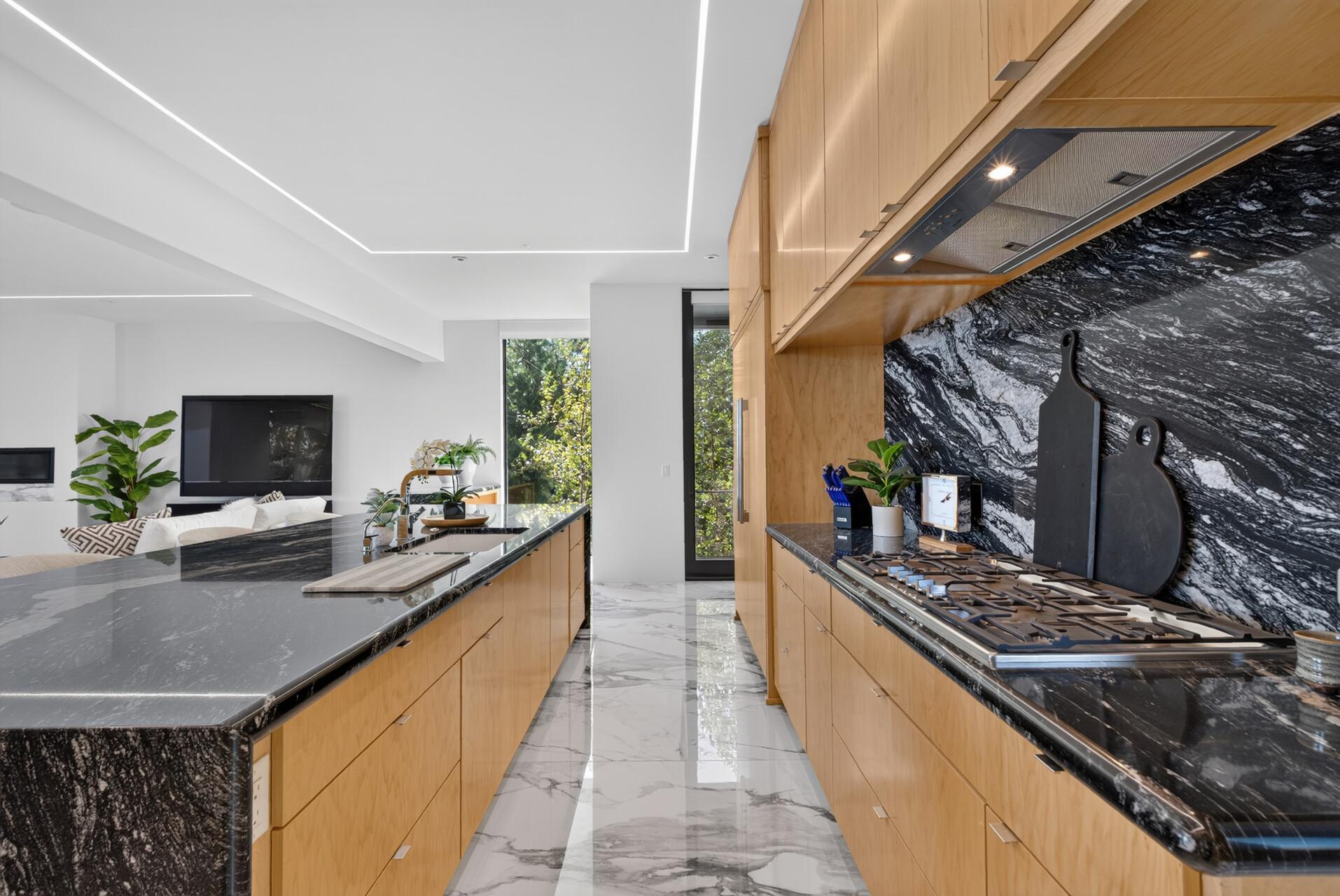 The backsplash continues seamlessly from the countertops for a clean, contemporary look.