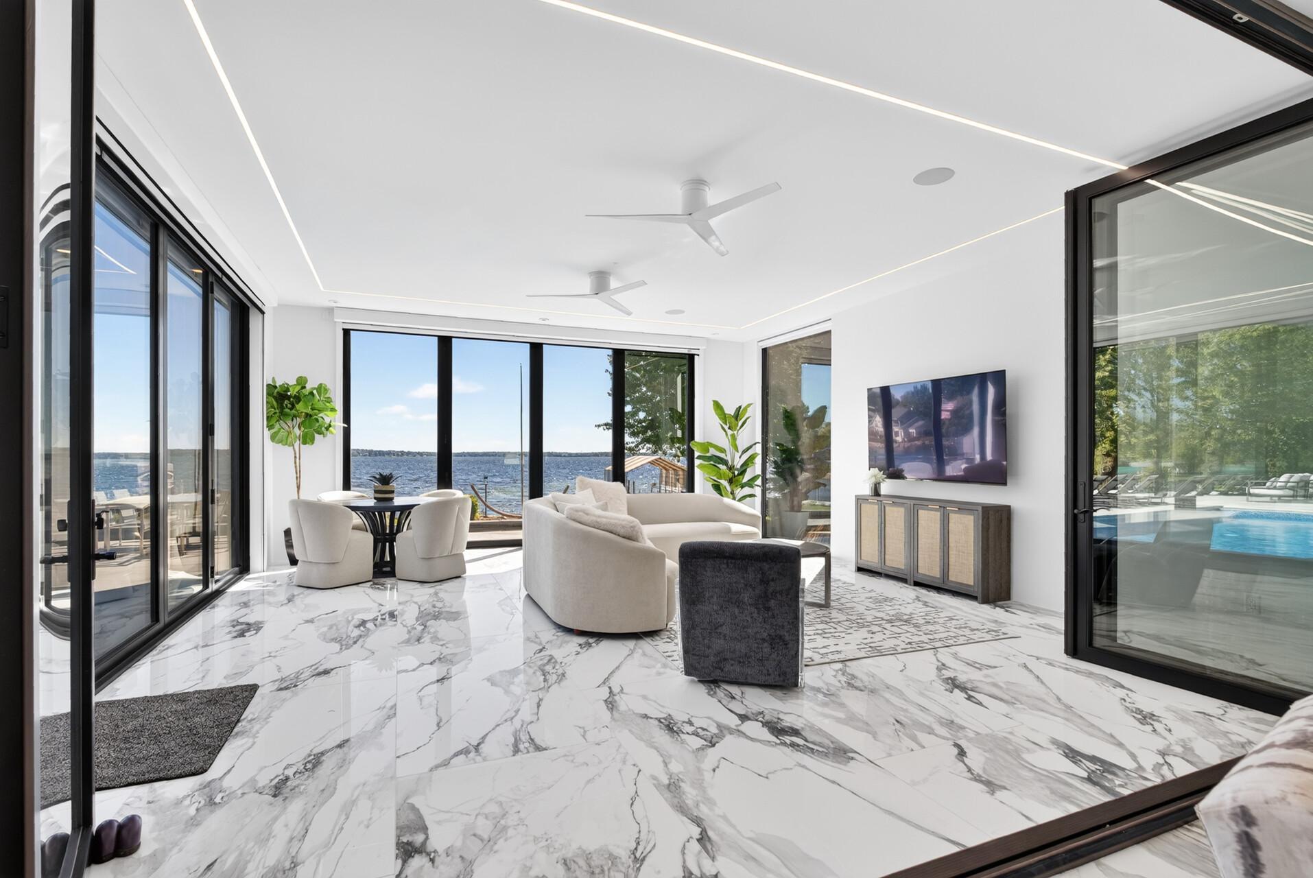 Continuous tiled flooring and direct walkout access to the pool deck.