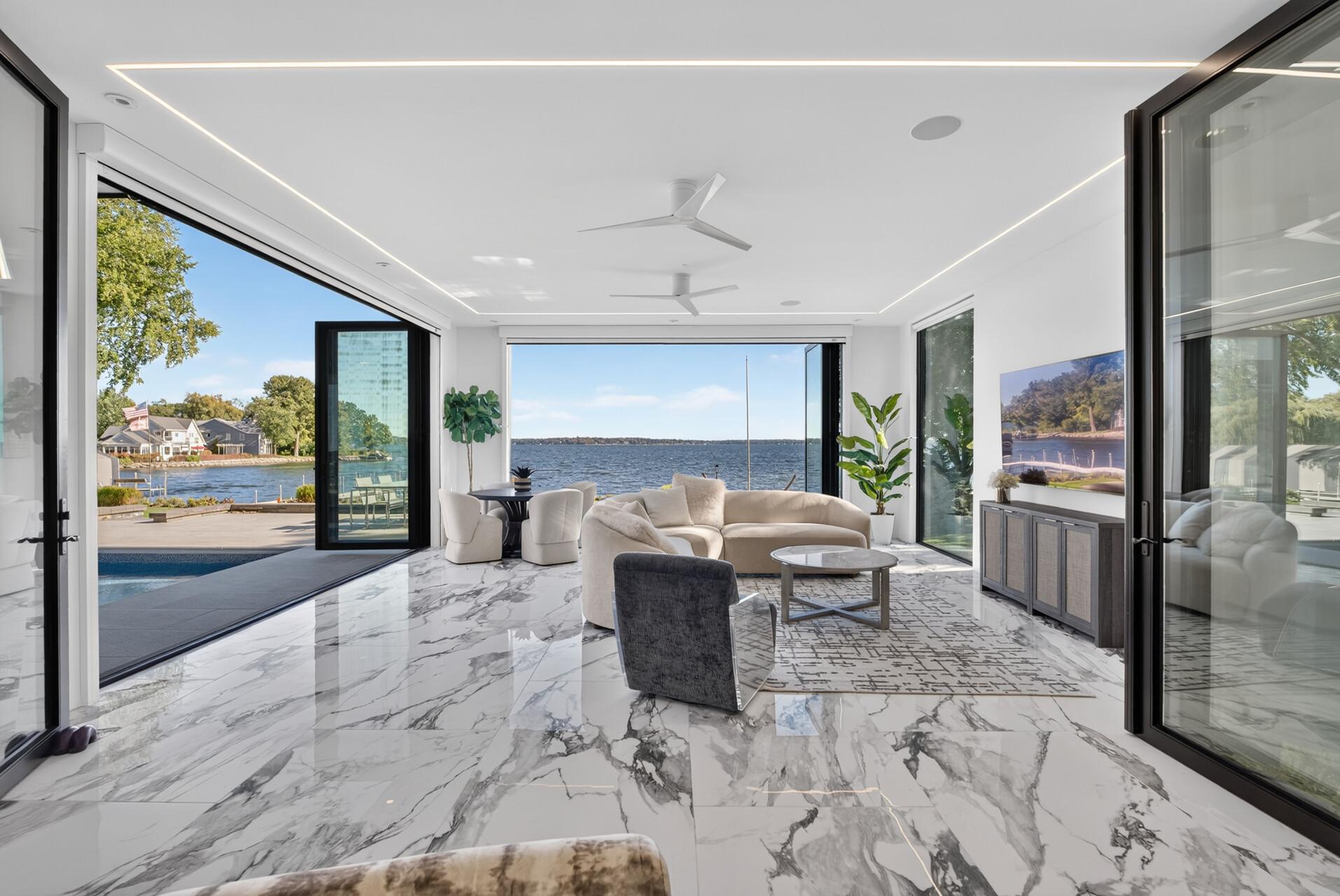 Full accordion doors open the sunroom completely to the adjacent living space and pool deck.