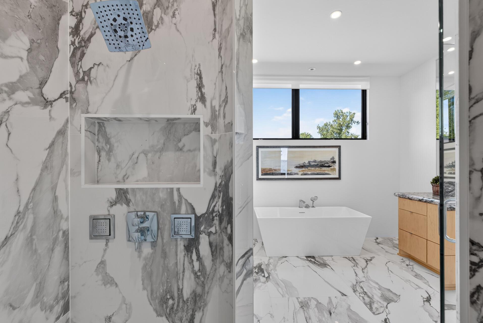 Freestanding tub, two separate vanities, and an integrated towel warmer for an effortless daily routine.