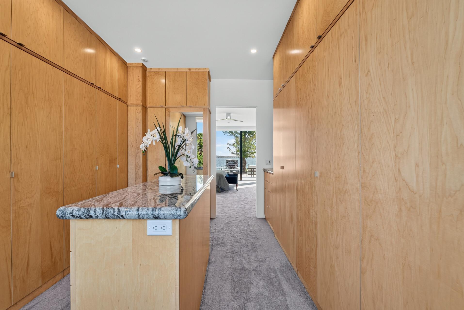 Large center island with outlets and motion-activated lighting.