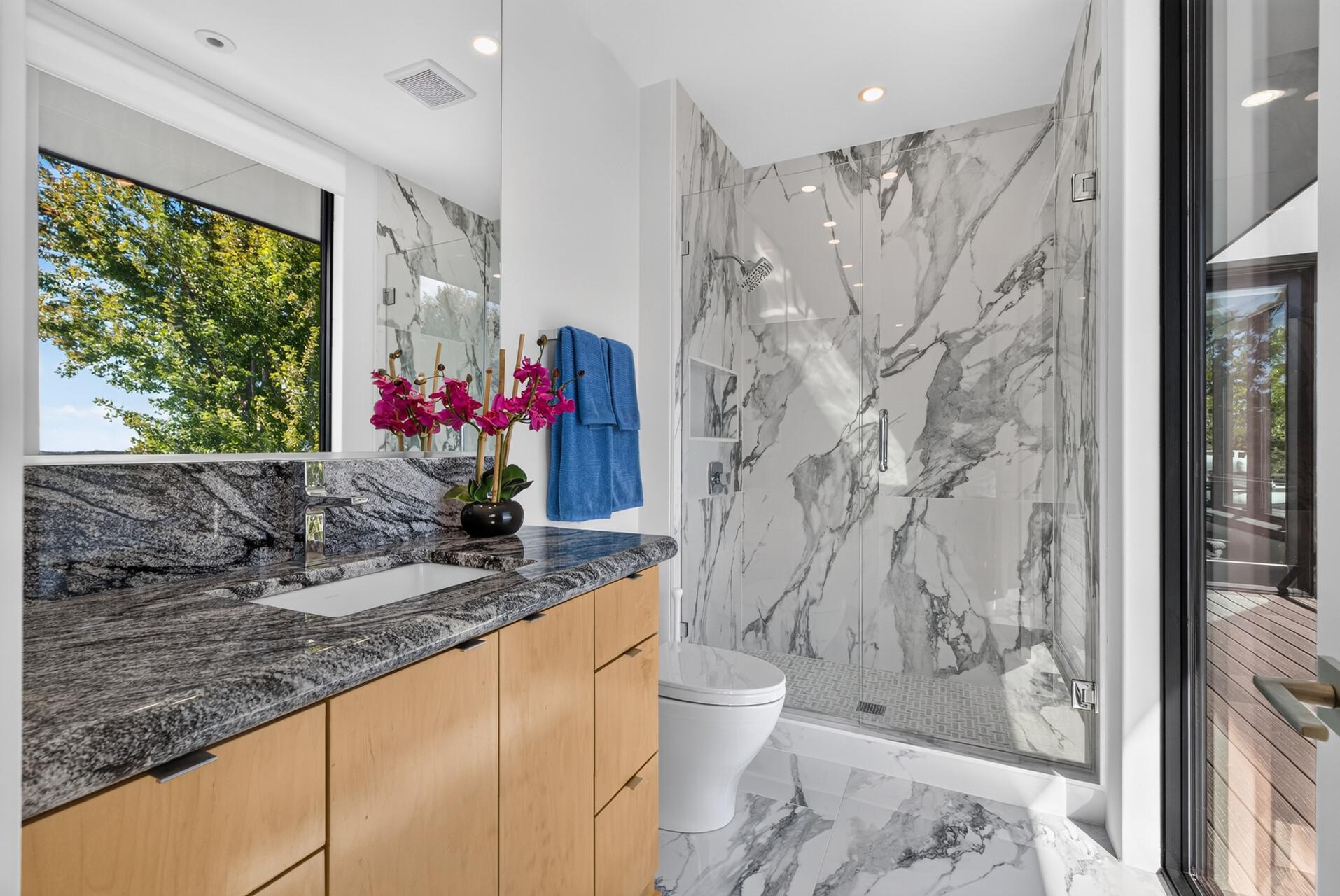 Each bedroom also has its own private ensuite with walk-in shower. (Ensuite - Upper-level bedroom #2)